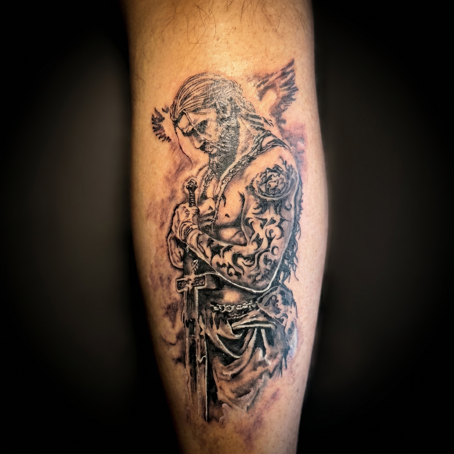 Black and grey medieval knight warrior tattoo on a calf